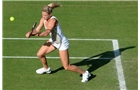 BIRMINGHAM, ENGLAND - JUNE 09:  Camila Giorgi of Italy returns a shot from Katy Dunne of Great Britain on day one of the AEGON Classic Tennis Tournament at Edgbaston Priory Club on June 9, 2014 in Birmingham, England.  (Photo by Tom Dulat/Getty Images)